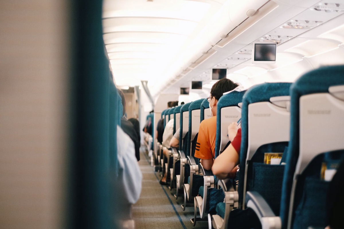Interior view of a modern commercial airplane cabin during flight