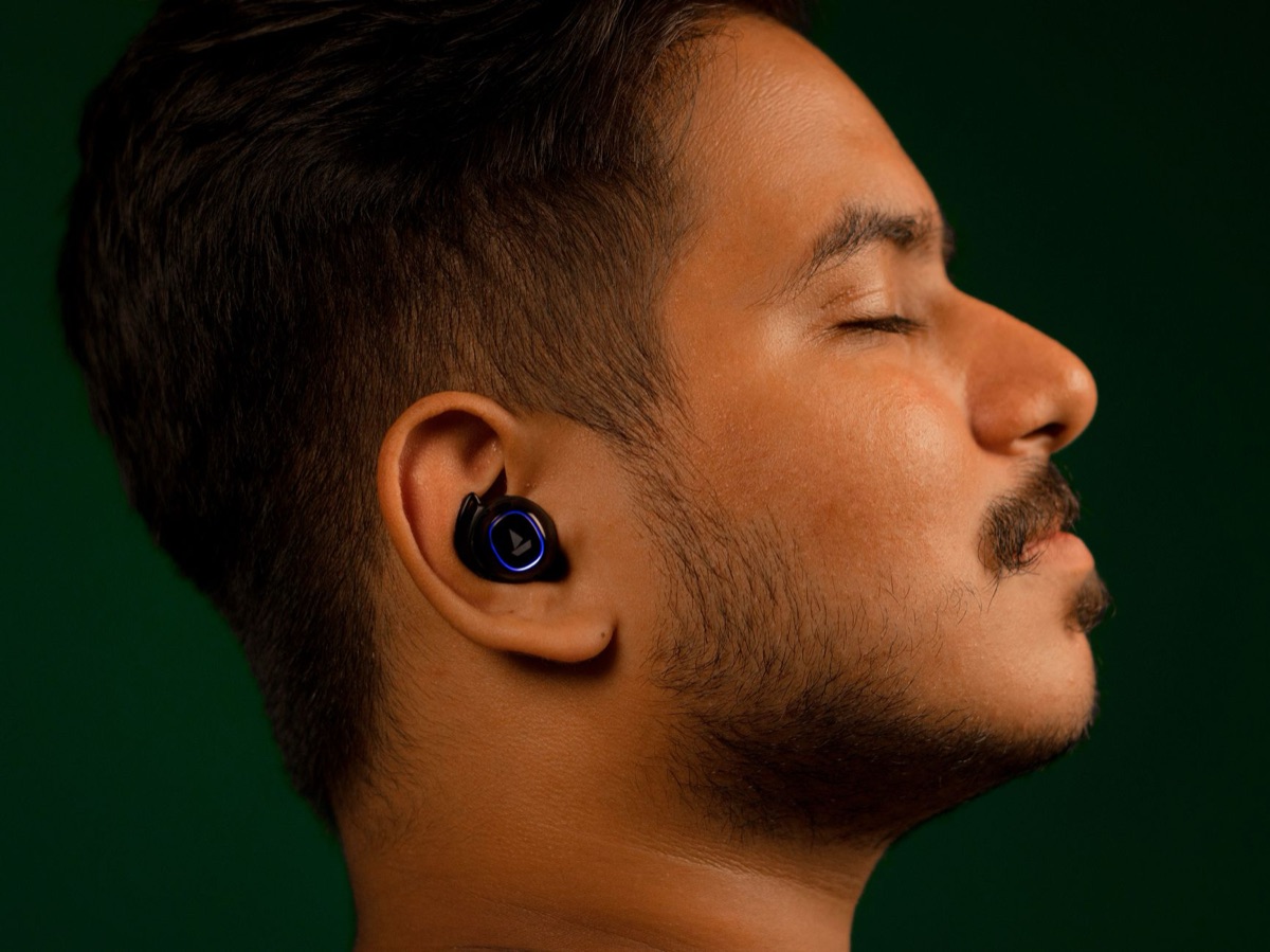 Waterproof earbuds with silicone tips and compact charging case